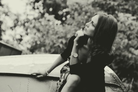 Thoughtful Woman Sat Outdoors
