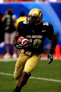 College Football Player Running With Ball