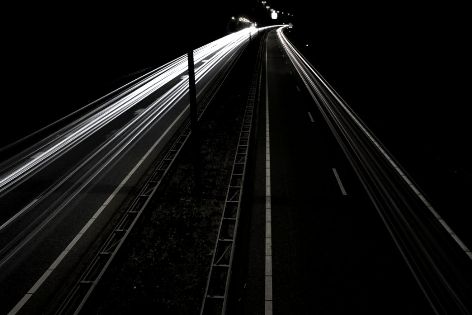 Headlight Streaks On Dark Road