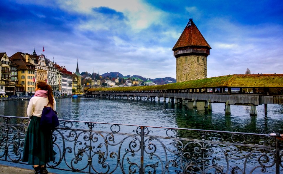 Woman On Waterfront In Switzerland