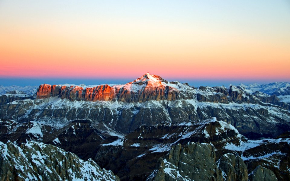 View Of Snow Covered Mountain During Sunset