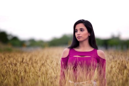Woman Standing In Wheat Field photo