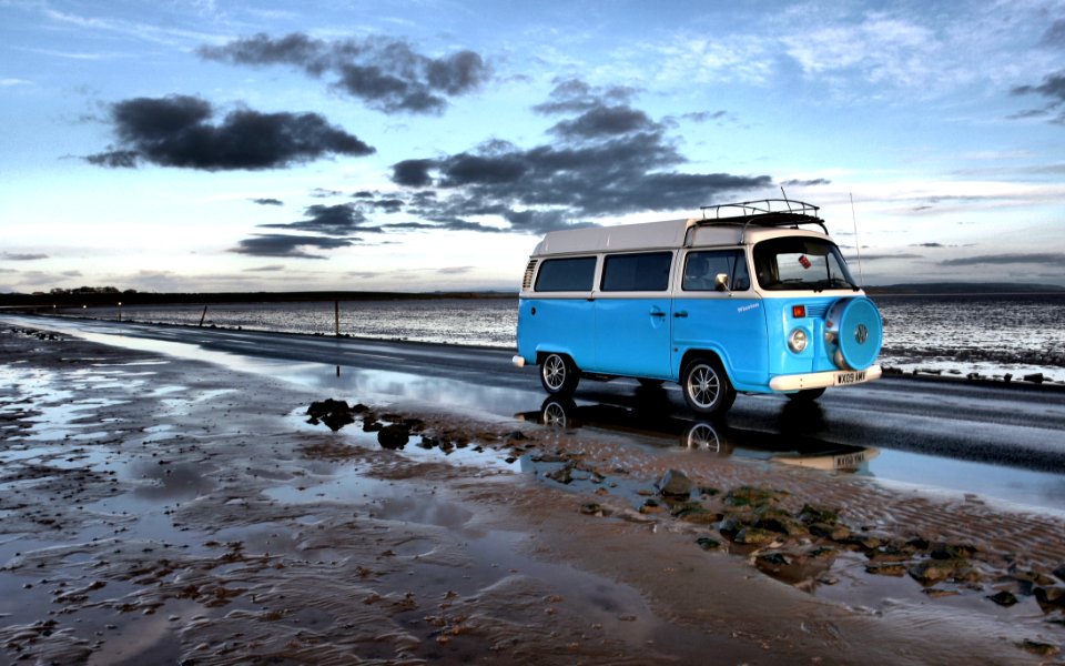 Campervan Driving Along Beach