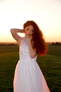 Woman Wearing White Dress On Field