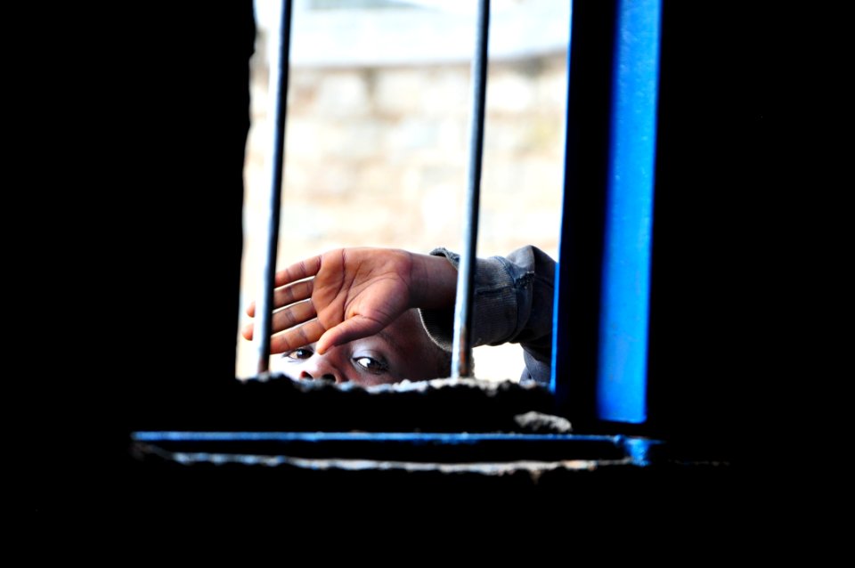 Face Of Person Peeking Through Window