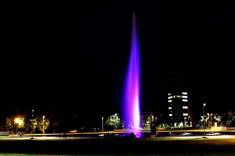 Illuminated Fountain In City Night Scene