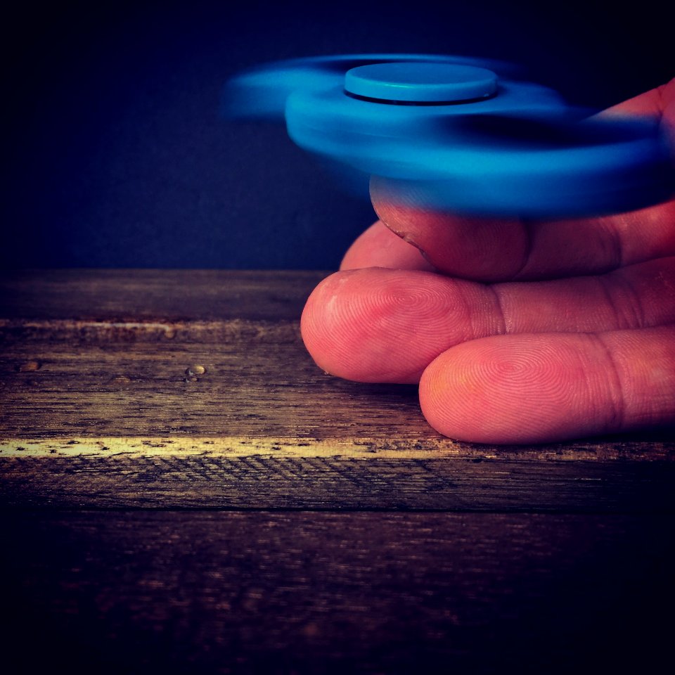Hand Holding Peg Top