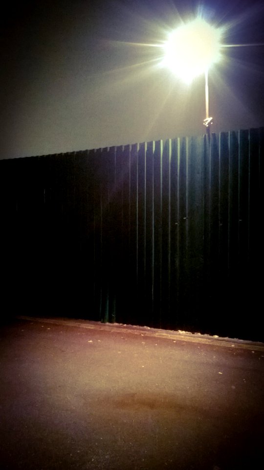 Black Fence Below Gray Light