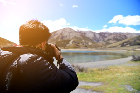 Photographer Taking Photo Of Landscape photo