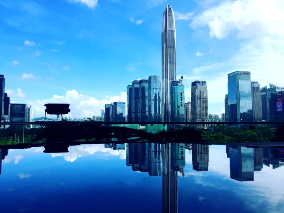 Skyscrapers Reflecting On Water Surface