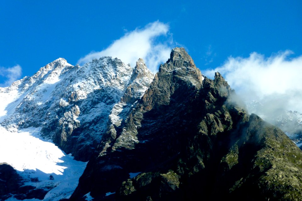Mountain Peaks Against Blue Skies