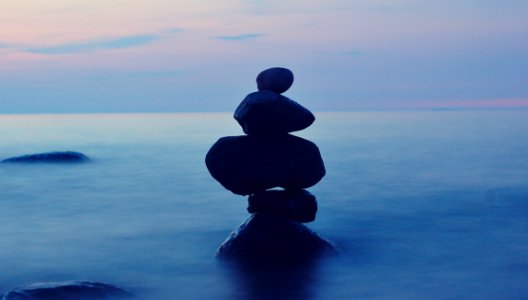 Balanced Stones In Sea