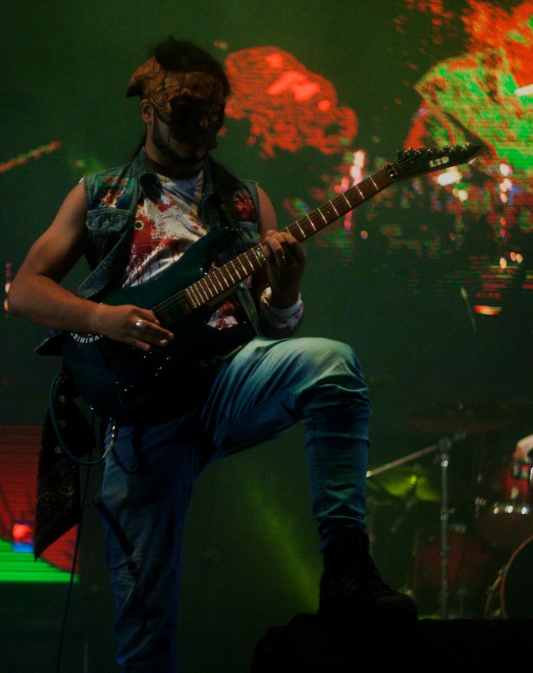 Bass Guitar Player With Mask