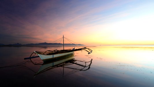 Boat On Water At Sunset photo