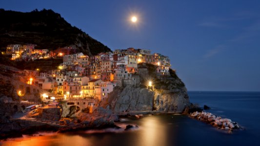 Coastal Town Illuminated At Night
