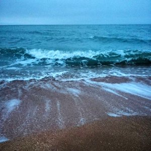 Waves Coming In To Sandy Beach