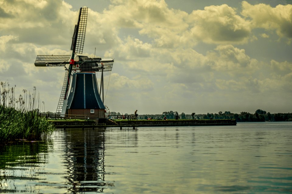Typical Dutch Windmill At A Lake