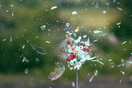 Exploding Glass With Colored Buttons