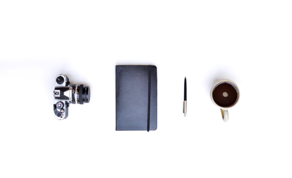 Camera Notebook Pen And Coffee