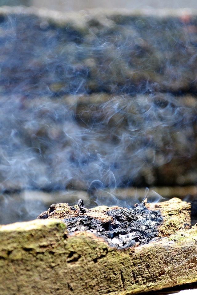 Burning burning log blue smoke