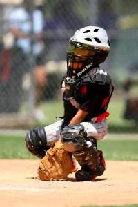 Boy In Black Power Balt Baseball Helmet photo