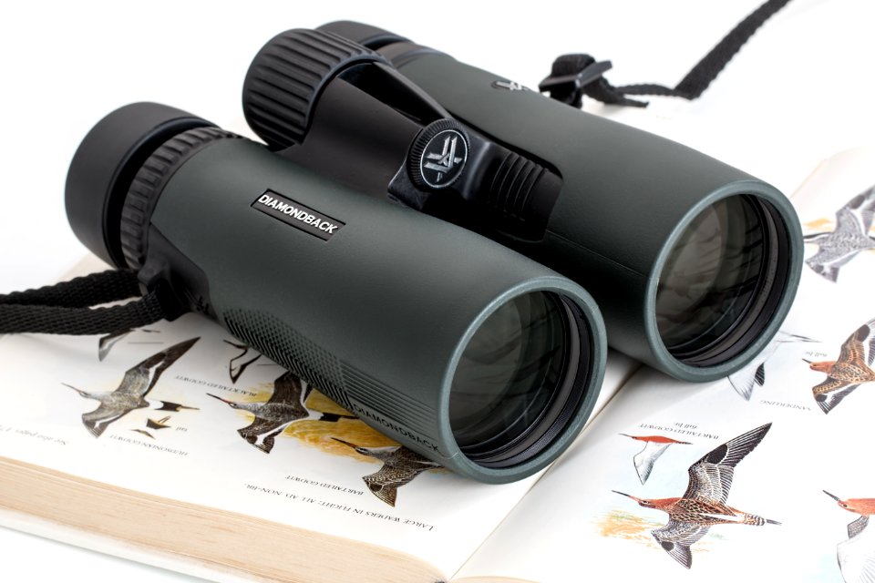 Pair Of Binoculars On A Book