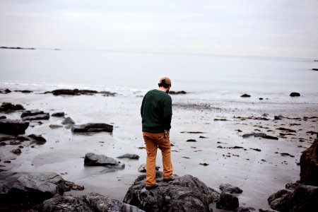 Man Standing On Rocks At Seaside photo
