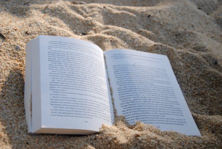 White Book On Sand During Daytime photo