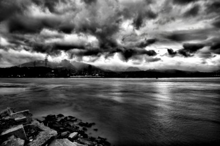 Grayscale Photo Of Sea During Cloudy Sky At Daytime photo