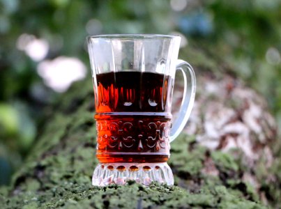 Selective Focus Of Clear Glass Mug With Red Liquor photo