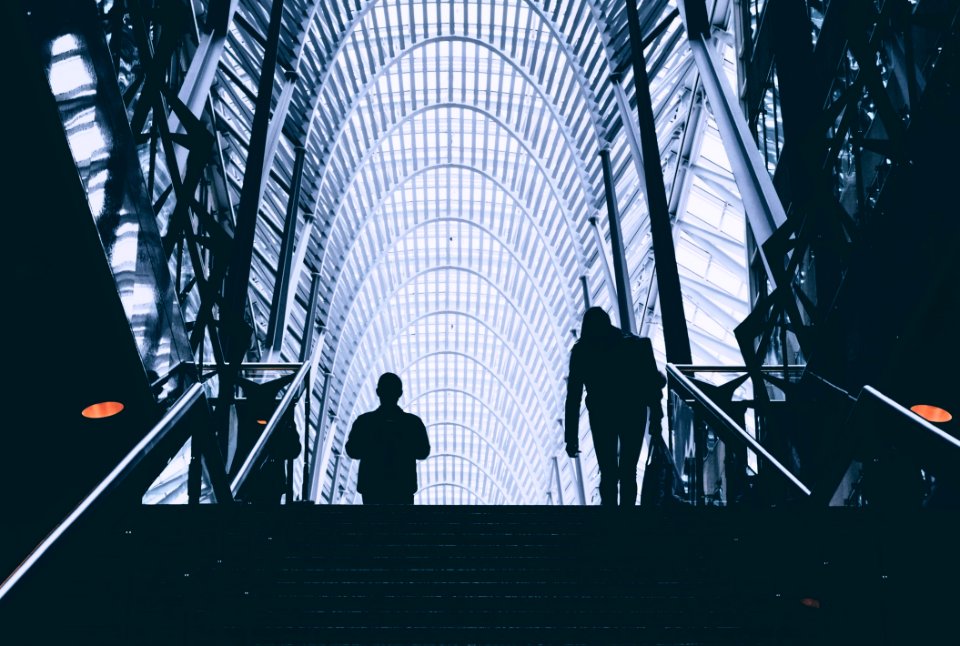 People On Stairs Inside Modern Building