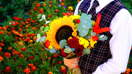 Boy With Bouquet Of Flowers