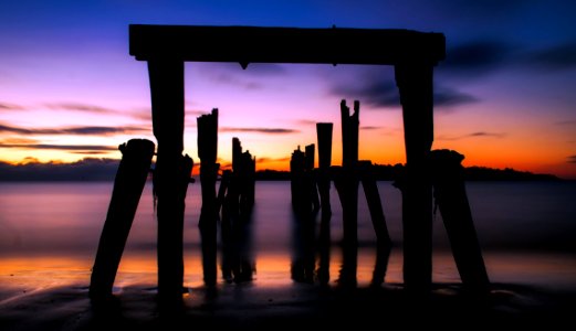 Scenic View Of Beach Against Sky During Sunset