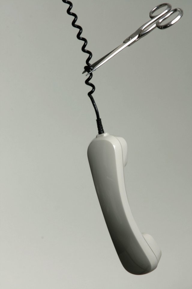 Scissors Cutting Telephone Cable