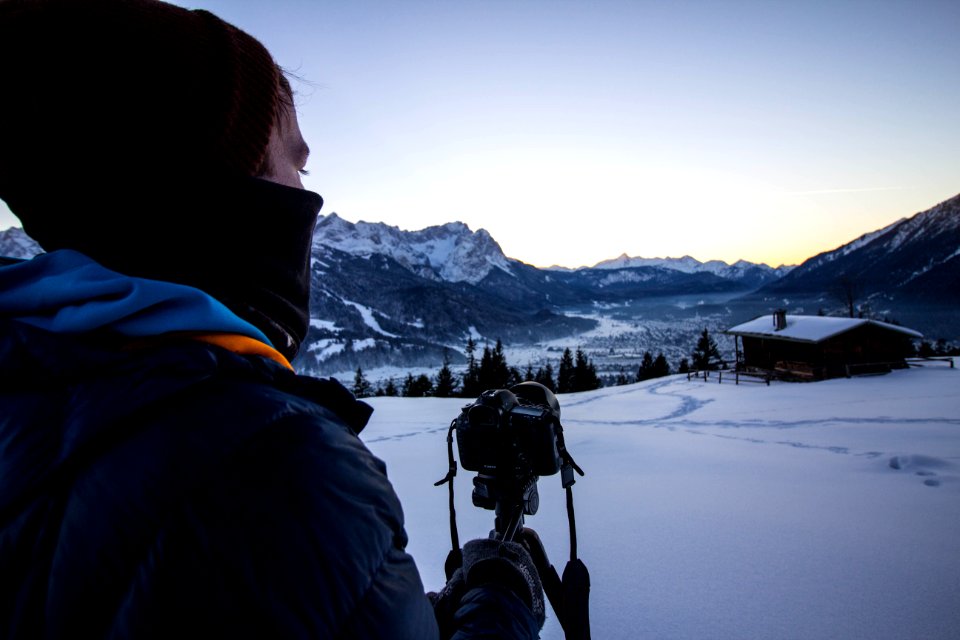 Photographer Photographing Snowy Landscape