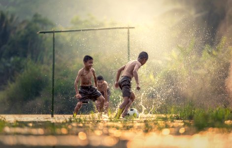 Boys Playing In Water photo