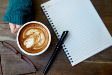 Coffee Cup And Notebook photo