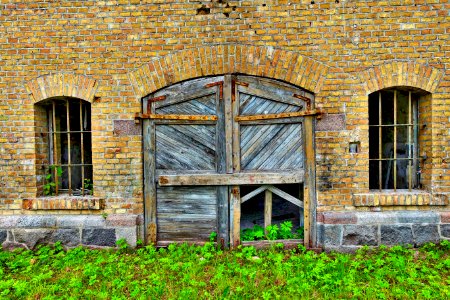 Wooden Door In Brick Wall photo
