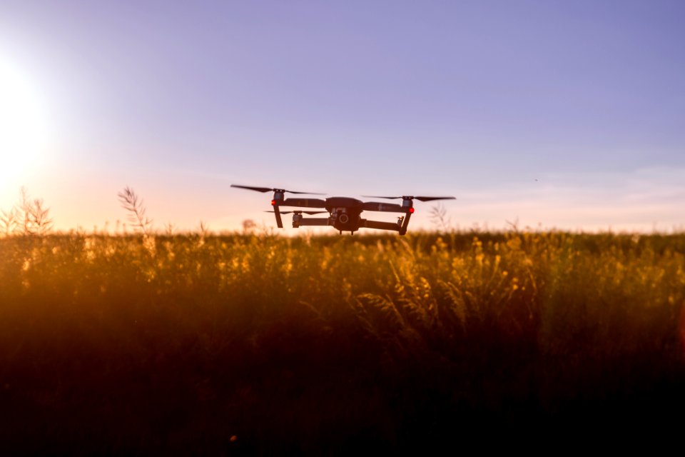 Drone Over Rural Field At Sunset