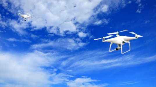 2 Quadcopter Under Blue Sky And White Clouds