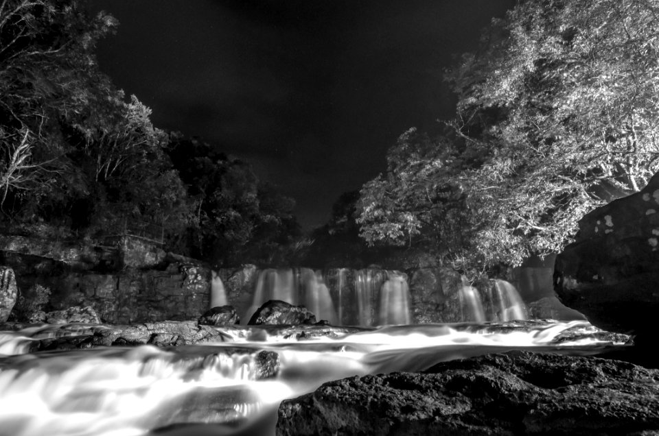 Greyscale Photo Of Waterfall During Nighttime photo