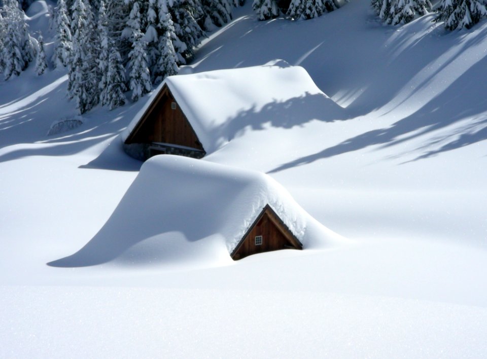 Cabins Covered In Snow