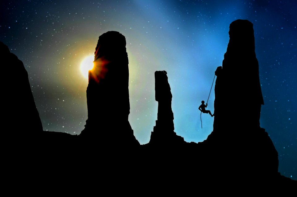 Cliff Climbing At Dusk
