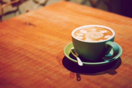Cup Of Coffee On Wooden Table photo