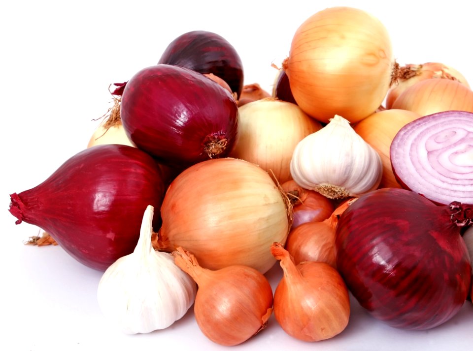 Onion And Garlic On White Surface
