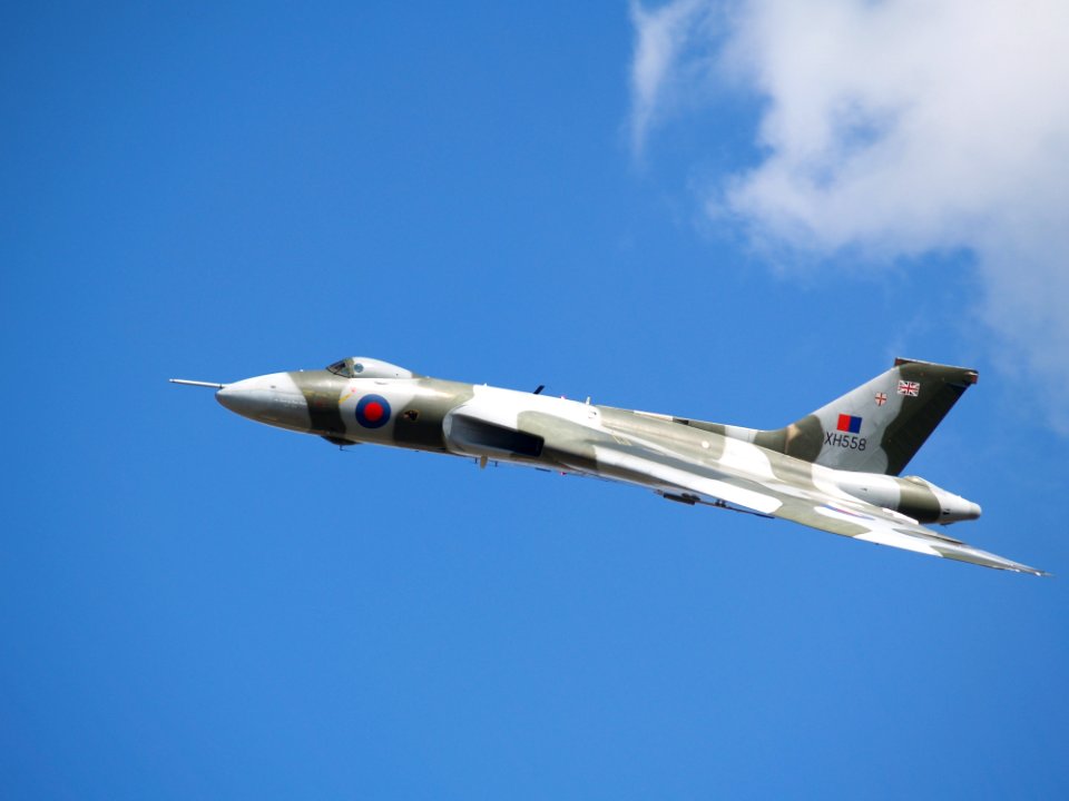 White And Grey Fighter Plane On Mid Air During Daytime