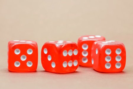 Close Up Photography Of 4 Red White Dice photo
