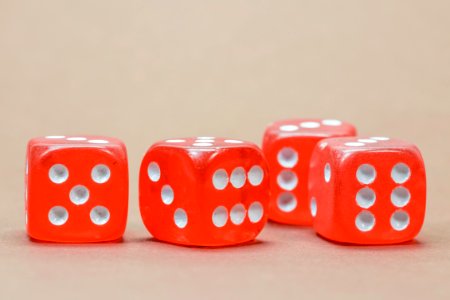 Close Up Photography Of 4 Red White Dice