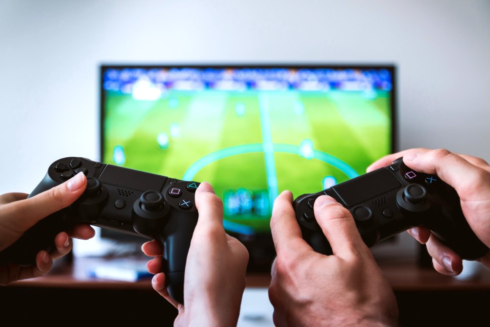 Hands Holding Gamepads