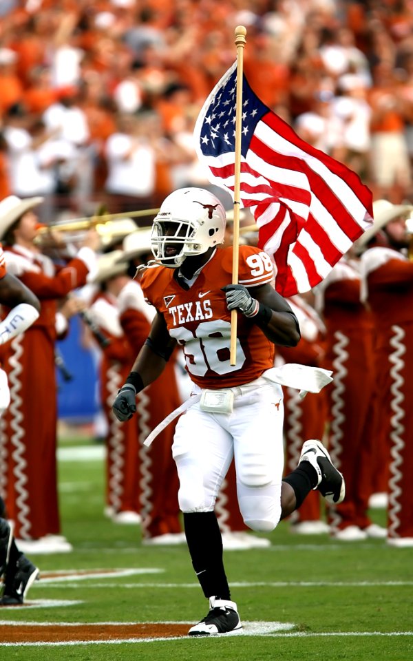 Nfl Player Holding Usa Flag On Field